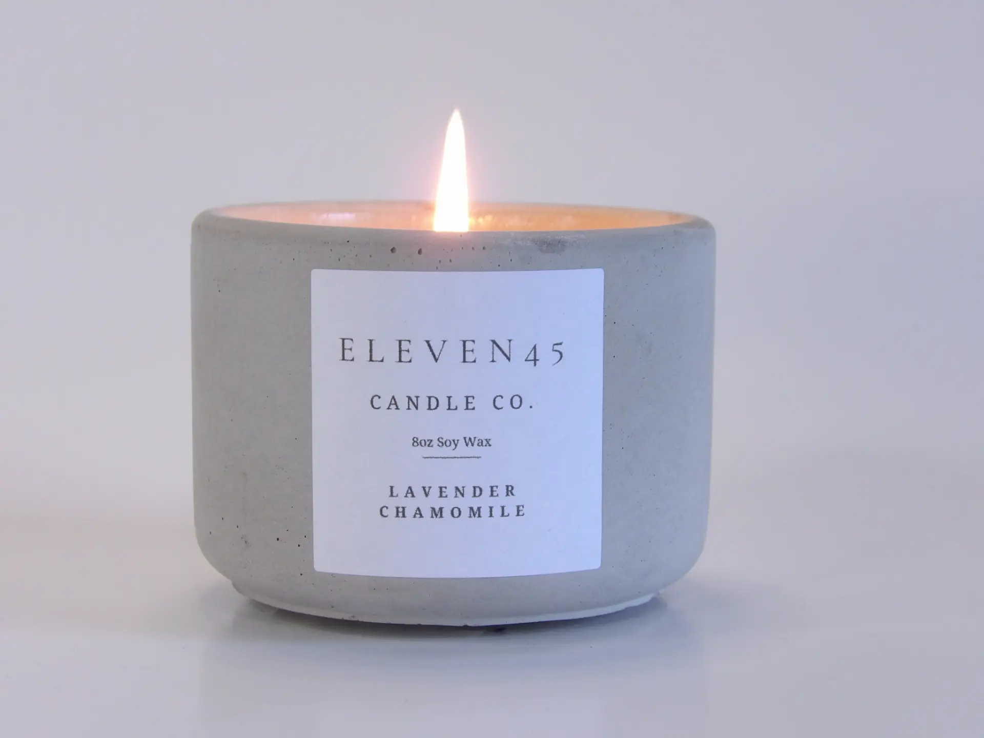 Lit Lavender Chamomile concrete candle by Eleven45 Candle Co. in Atlanta