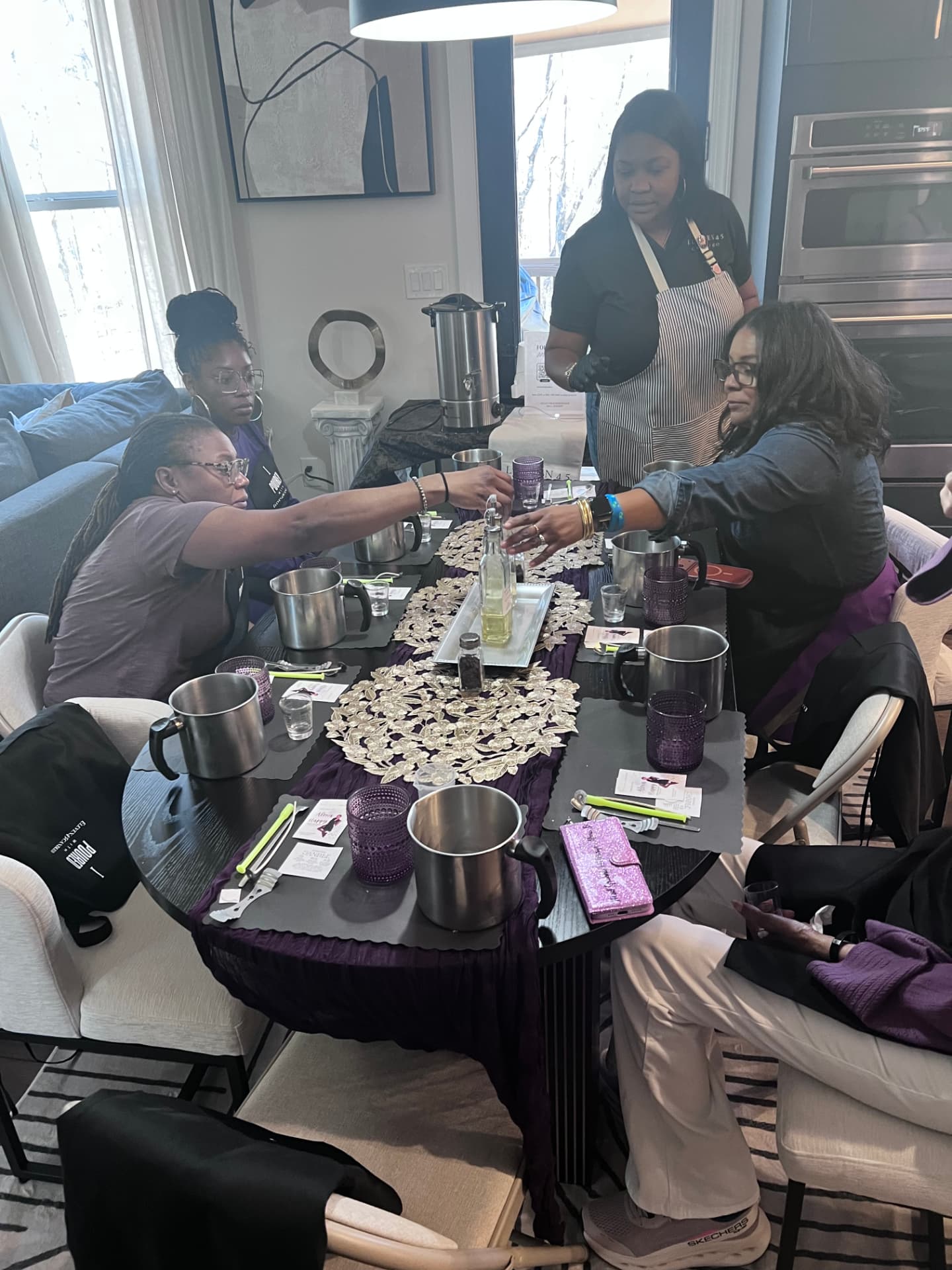Guests pouring candles at an Eleven45 pour party in Atlanta