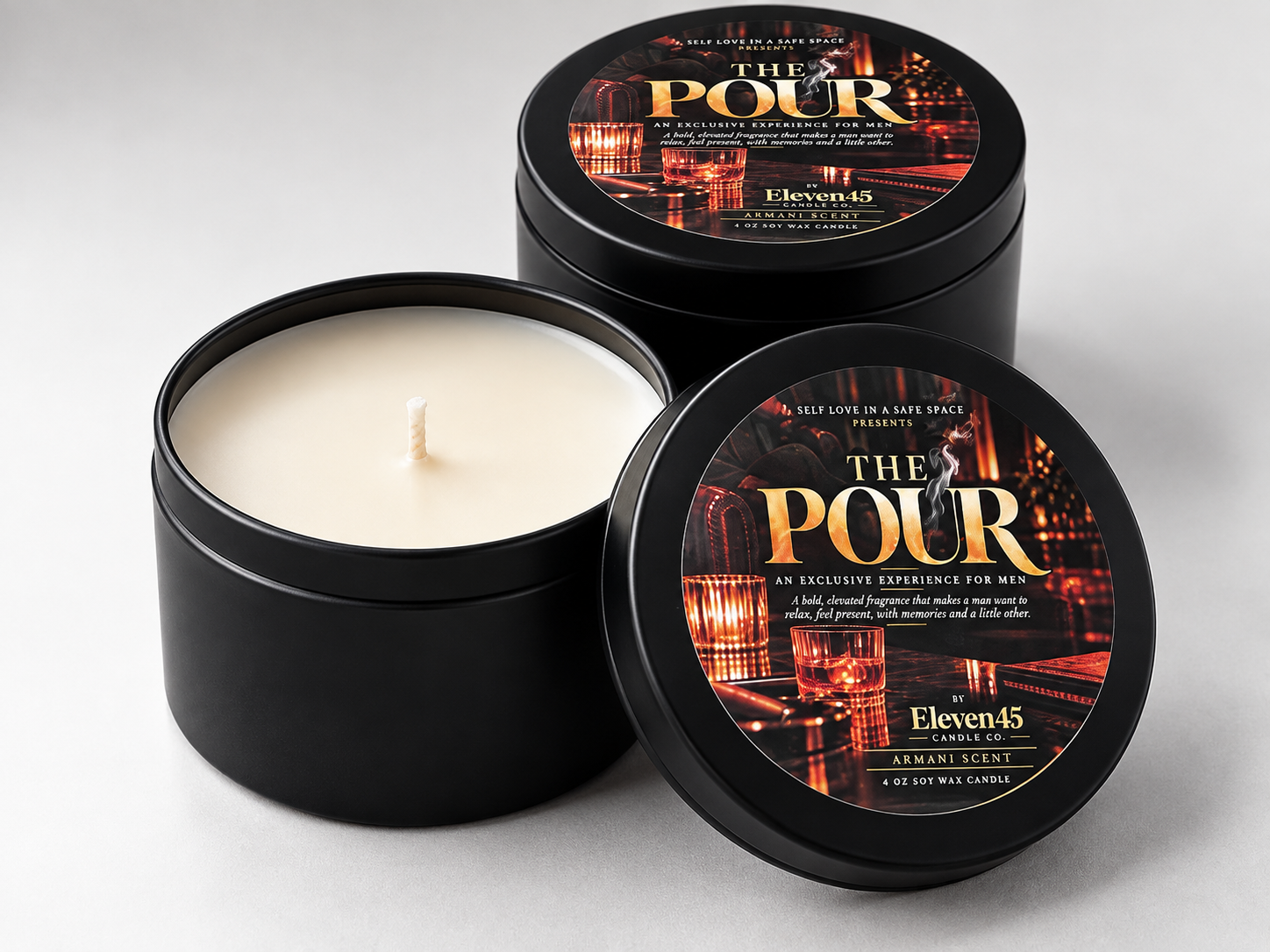 Black tin candles with The Pour labels, an exclusive men's experience by Self Love in a Safe Space and Eleven45 Candle Co.